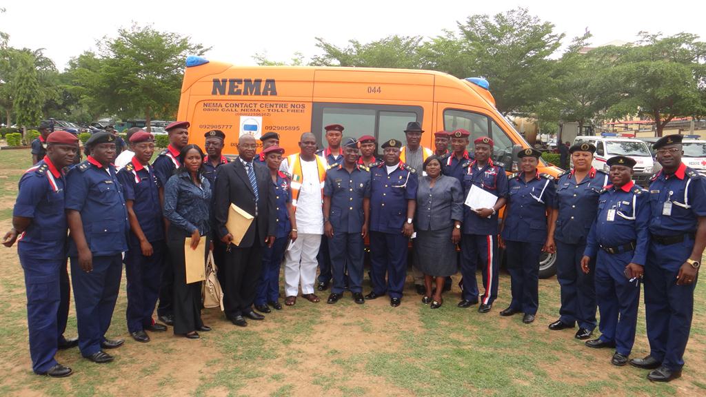 Center L NEMA Director Search and Rescue Charles Otegbade R Deputy Commandant General NSCDC Suleman Bello in a group photogrpher with other members of NEMA and NSCDC staff after presentation of MICU